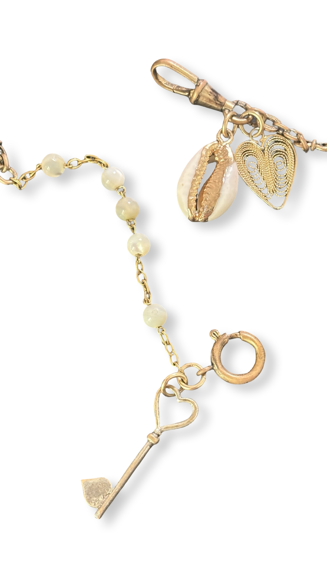 Collier filigrane, coquillage, cœur et clé