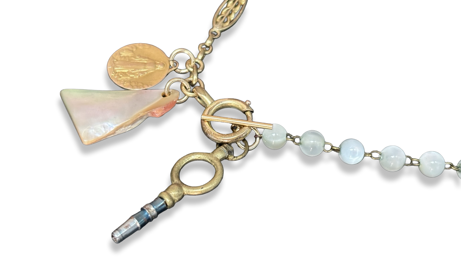 Collier chaîne de montre, chapelet de nacre et médaille de la Vierge.