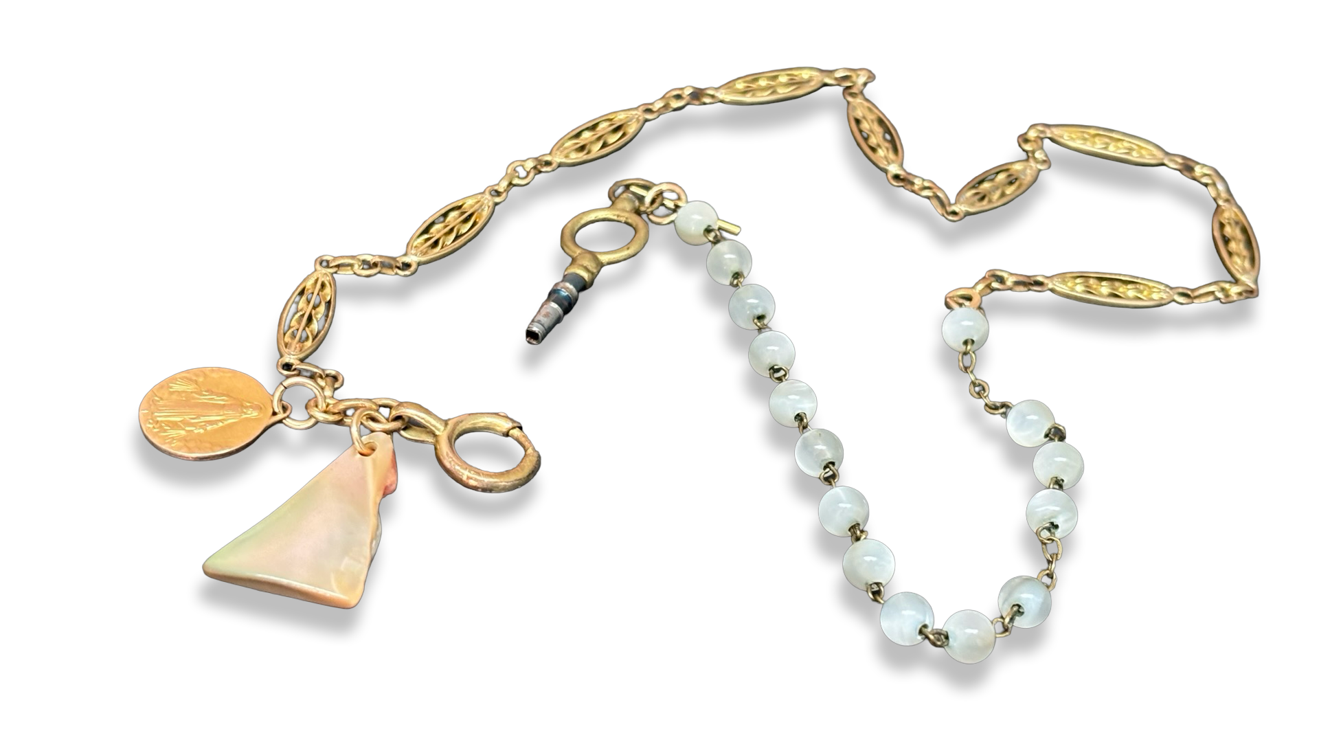 Collier chaîne de montre, chapelet de nacre et médaille de la Vierge.