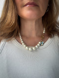 Fancy pearl necklace and turquoise silk thread.